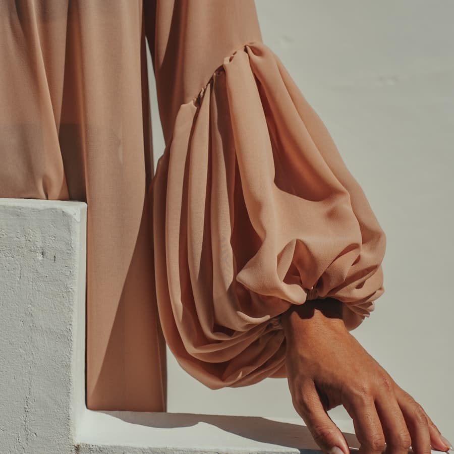 The Sana silk scarf folded in camel